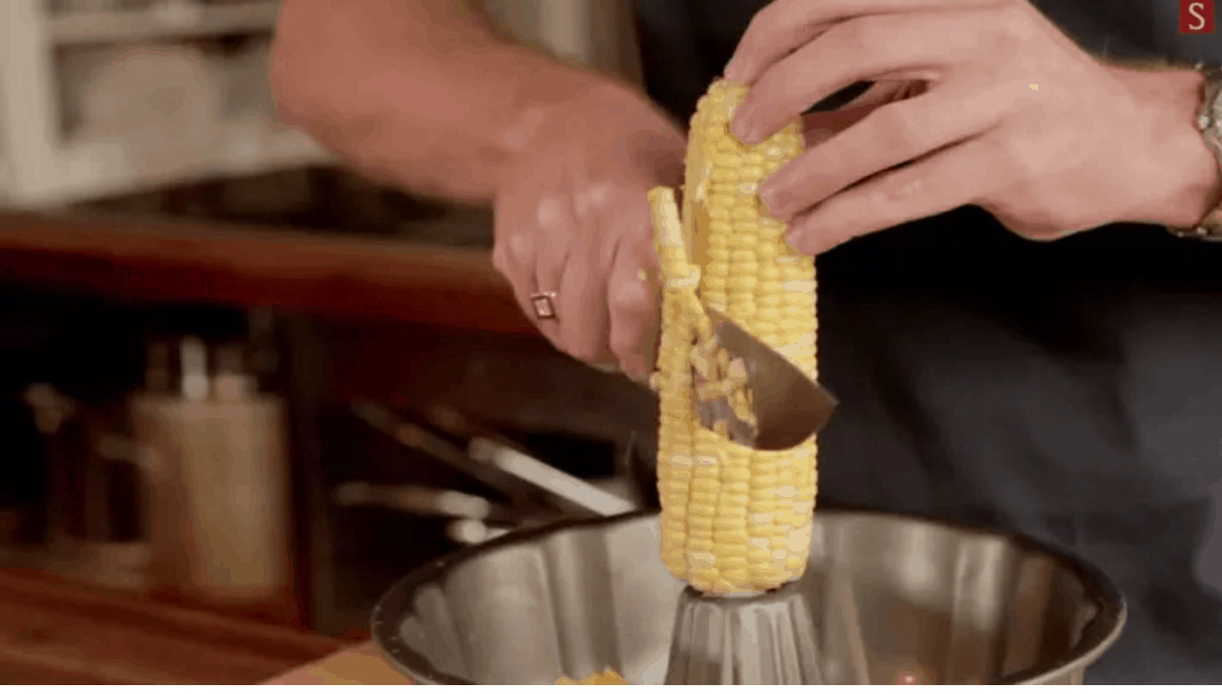 Hack #8: Cut corn off the cob with ease using a bundt cake pan