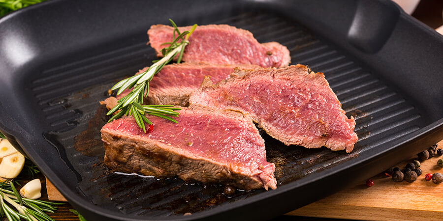 https://cdn2.gofoodservice.com/cms/close-up-slices-rare-roast-beef-frying-ridged-skillet-cast-iron-pan-seasoned-with-fresh-herbs-rosemary.6040f4c2d0053.jpg